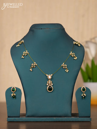 Invisible chain in floral design with green stones