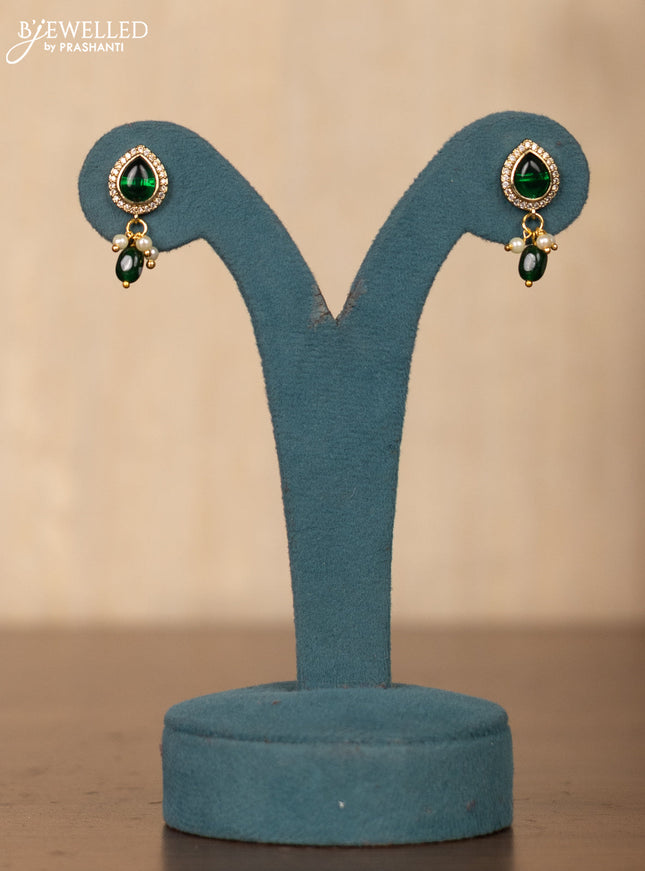 Invisible chain in floral design with green stones
