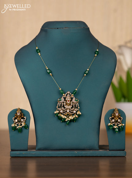 Invisible chain tirupati balaji face pendant in green stones and green beads hanging