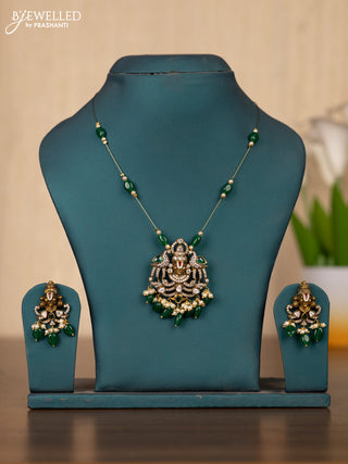 Invisible chain tirupati balaji face pendant in green stones and green beads hanging