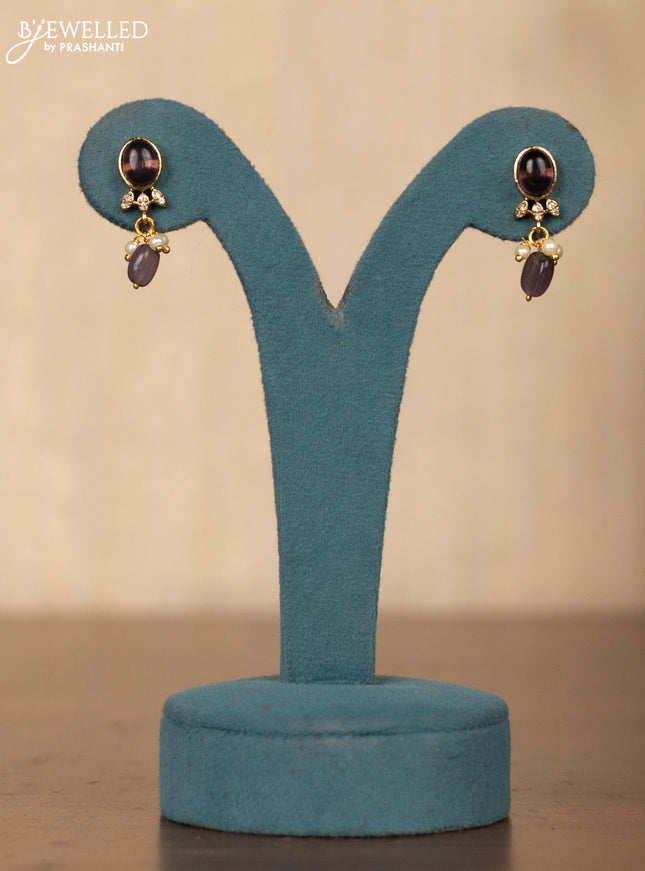 Invisible chain double swan design in purple stones and purple beads hanging