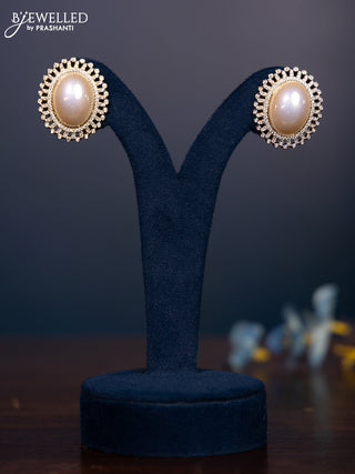 Zircon earring with cz stones and pearl in gold finish