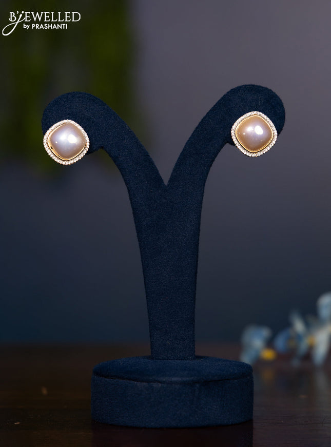 Zircon earring with cz stones and pearl in gold finish