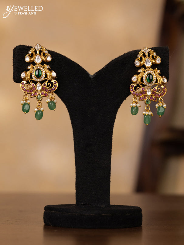Antique guttapusalu necklace double peacock design in multicolor kemp and kundan stones and rice pearl hangings