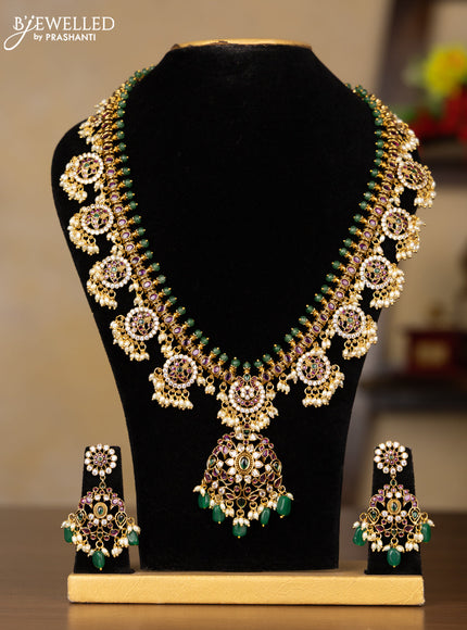 Antique Guttapusalu Haaram with double peacock pendnat and floral design in multicolor kemp stones and rice pearl hangings