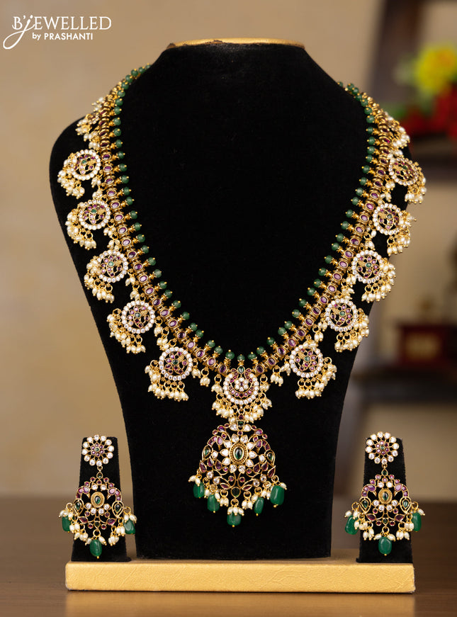 Antique Guttapusalu Haaram with double peacock pendnat and floral design in multicolor kemp stones and rice pearl hangings