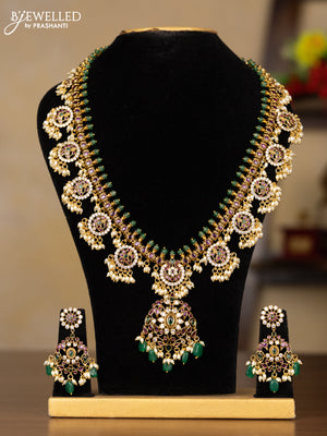 Antique Guttapusalu Haaram with double peacock pendnat and floral design in multicolor kemp stones and rice pearl hangings