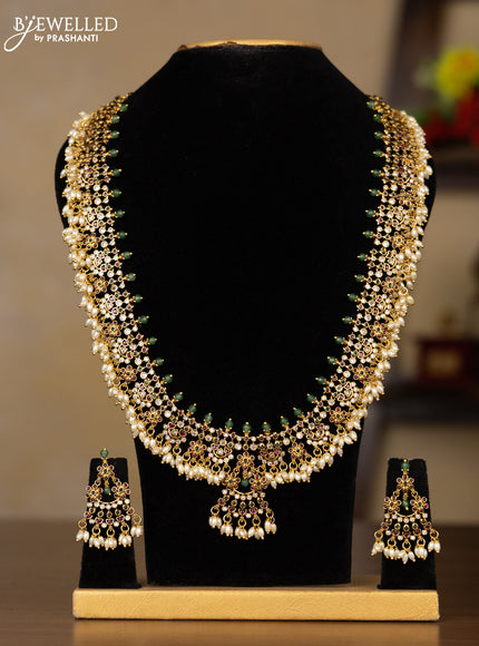Antique Guttapusalu Haaram with floral design in multicolor kemp stones and rice pearl hangings