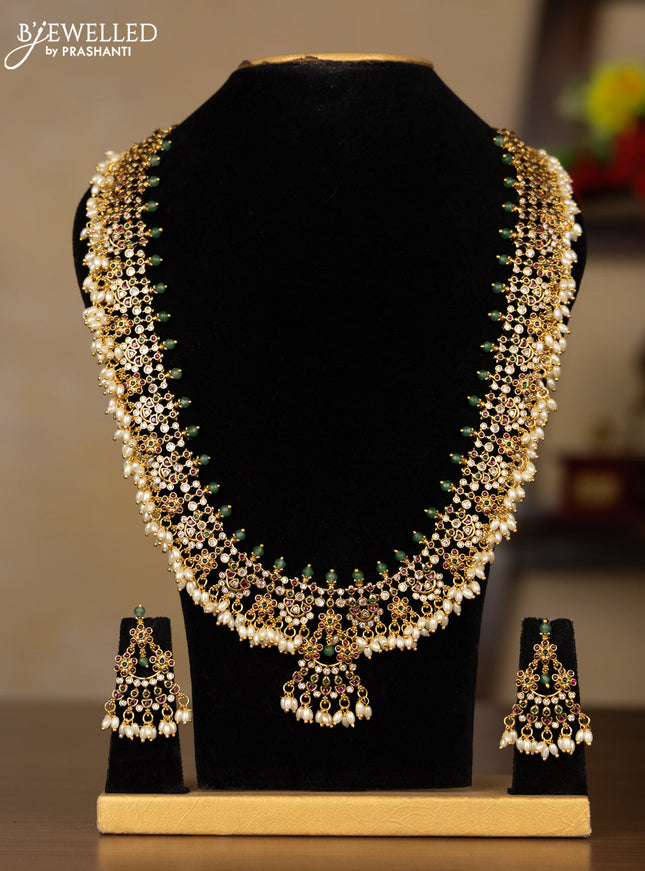 Antique Guttapusalu Haaram with floral design in multicolor kemp stones and rice pearl hangings