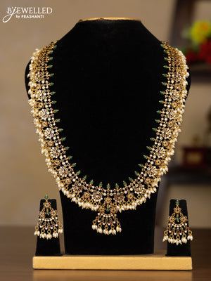 Antique Guttapusalu Haaram with floral design in multicolor kemp stones and rice pearl hangings