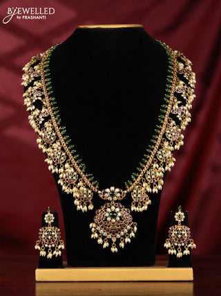 Antique Guttapusalu Haaram with peacock pendnat and floral design in multicolor kemp stones and rice pearl hangings