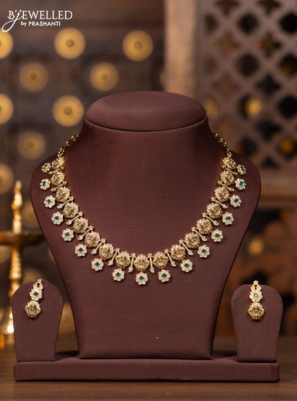 Antique necklace with lakshmi floral design in white and green stones