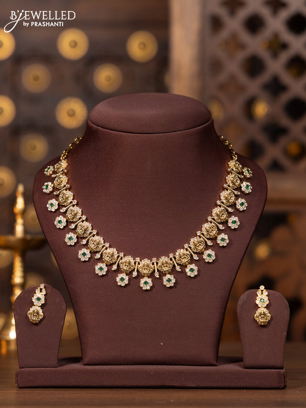 Antique necklace with lakshmi floral design in white and green stones