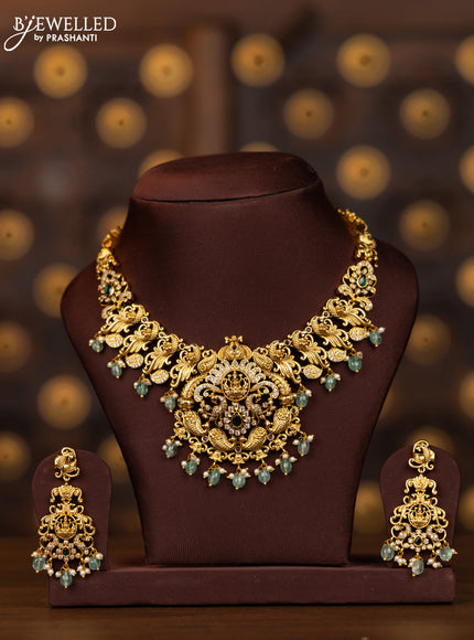 Antique necklace lakshmi peacock deisgn in white and green stones and mint green beads hanging