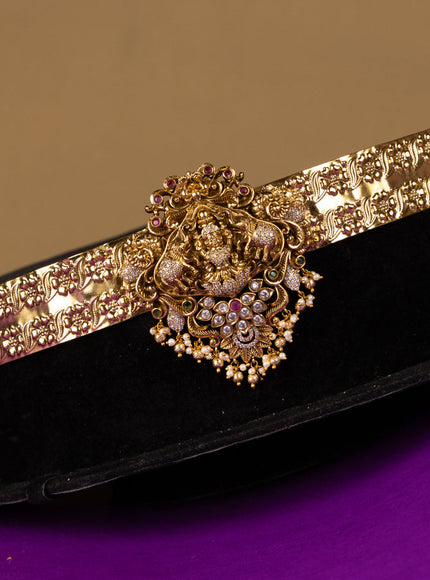 Antique hip belt lakshmi design in red & white kemp stones with self emboss design in the belt