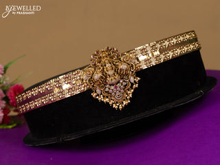 Antique hip belt lakshmi design in red & white kemp stones with self emboss design in the belt