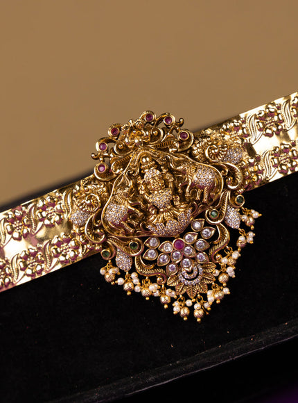 Antique hip belt lakshmi design in red & white kemp stones with self emboss design in the belt