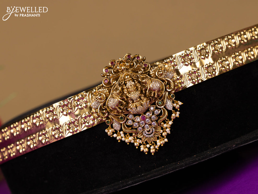 Antique hip belt lakshmi design in red & white kemp stones with self emboss design in the belt