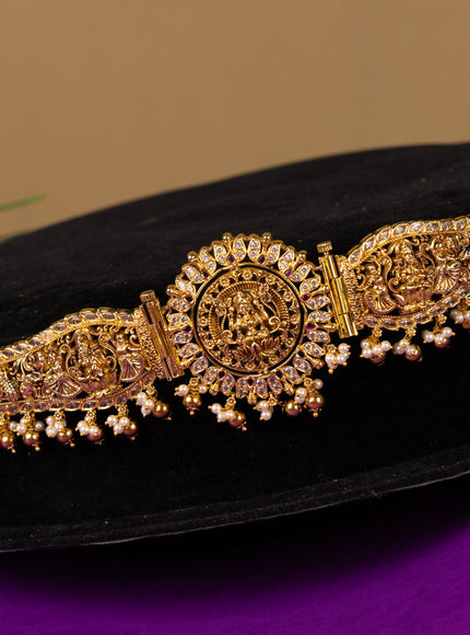 Antique hip belt with rotating lakshmi and peacock pendant in white and red stones and pearl hanging with removable pendant