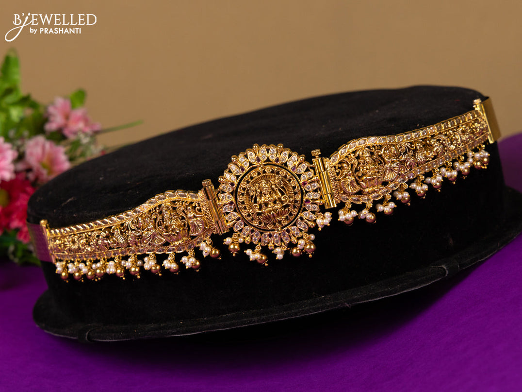 Antique hip belt with rotating lakshmi and peacock pendant in white and red stones and pearl hanging with removable pendant