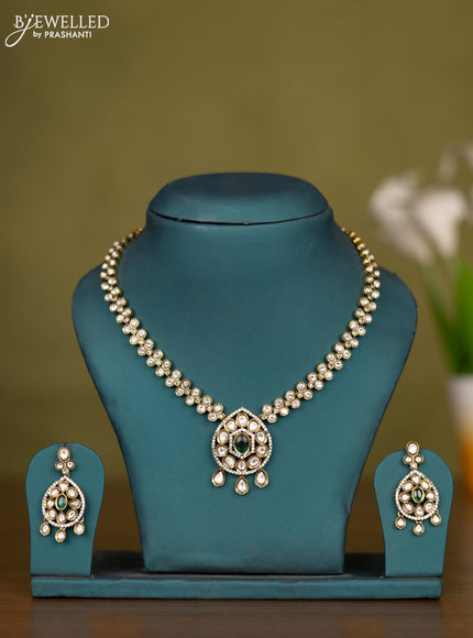 Necklace with emerald & kundan cz stones and hangings in victorian finish