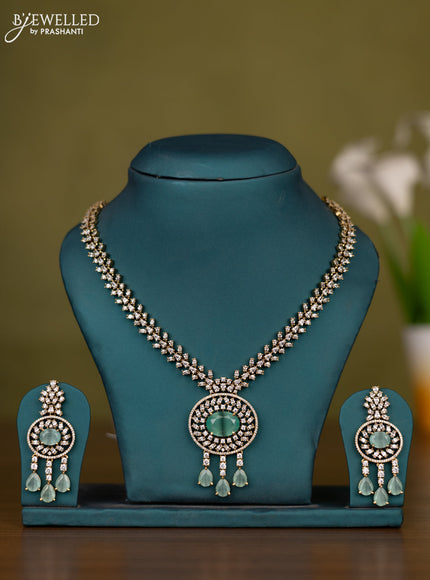 Necklace with mint green & cz stones and hangings in victorian finish