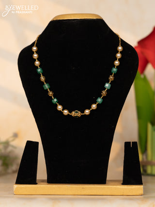 Beaded necklace with mint green, pearls and antique beads in green stones