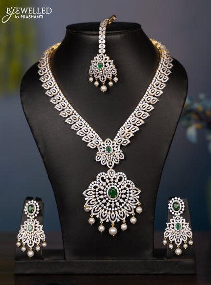 Zircon necklace leaf deisgn with cz and green stone with maang tikka in gold finish