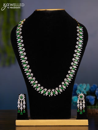 Zircon haaram with emerald and cz stones in gold finish