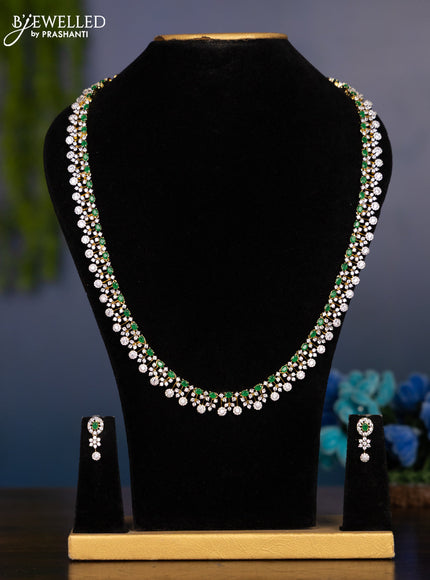 Zircon haaram with emerald and cz stones in gold finish