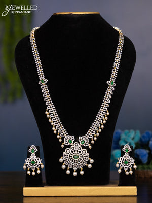 Zircon haaram with emerald & cz stones and pearl hangings in gold finish