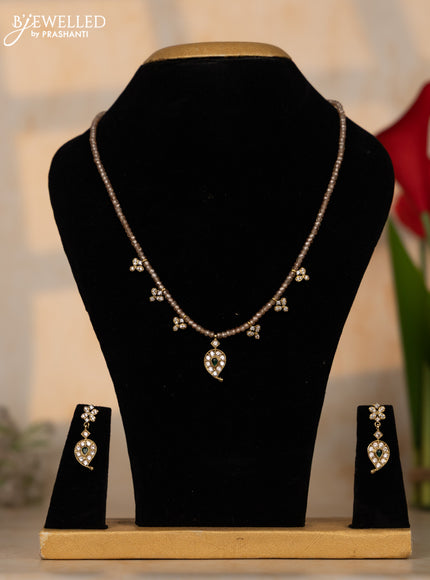 Crystal beaded peach necklace manga pendant with emerald and cz stones in victorian finish
