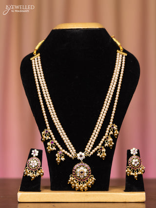 Pearl triple layer necklace with kemp and cz stones in pearl & golden beads hangings