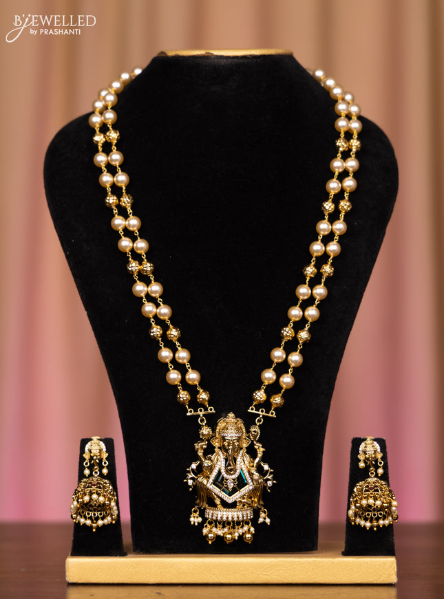Pearl double layer necklace ganesha pendant with emerald and cz stones in pearl & golden beads hangings