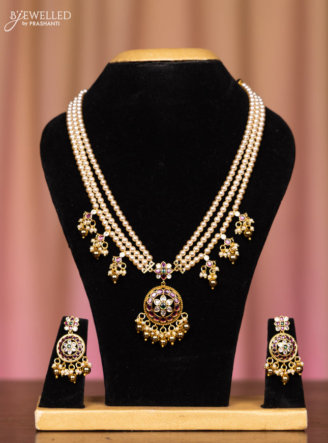 Pearl triple layer necklace with kemp and cz stones in pearl & golden beads hangings
