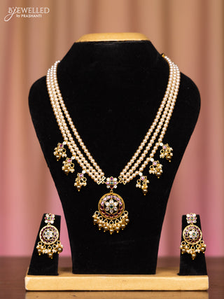 Pearl triple layer necklace with kemp and cz stones in pearl & golden beads hangings