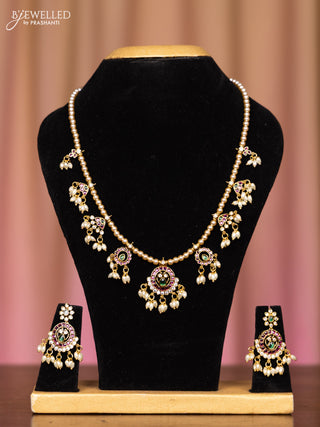 Pearl necklace with kemp and cz stones in pearl hangings