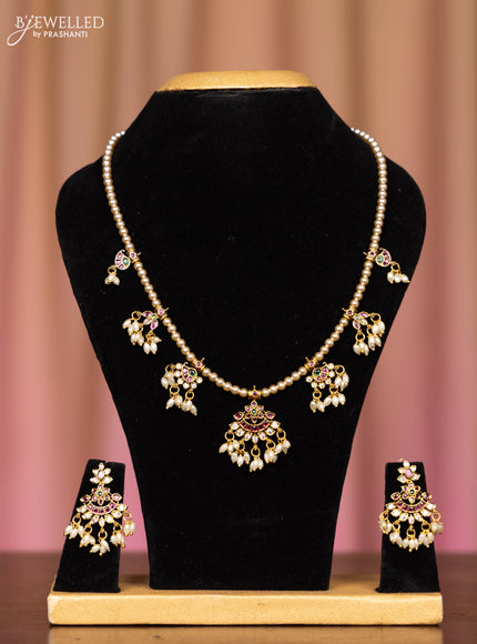 Pearl necklace with kemp and cz stones in pearl hangings