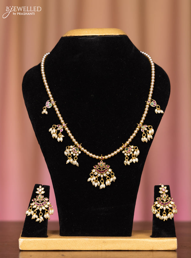 Pearl necklace with kemp and cz stones in pearl hangings