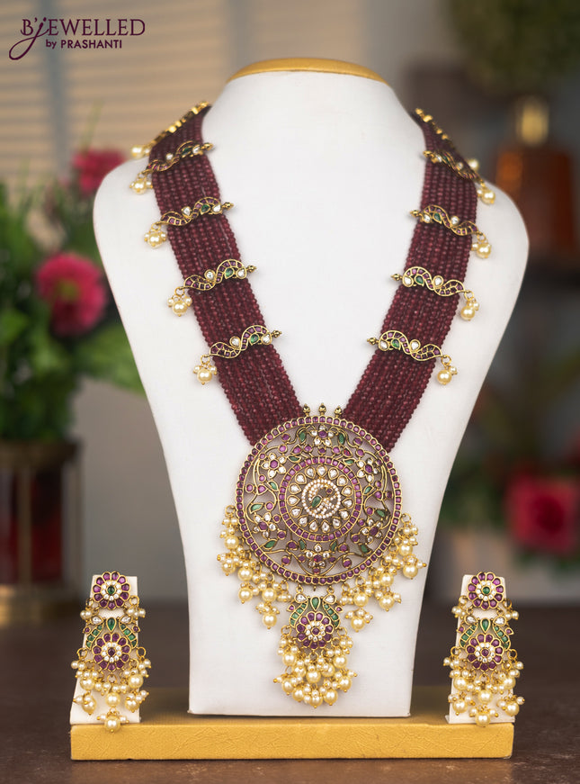 Beaded multilayer maroon haaram with kemp stones and pearl hangings