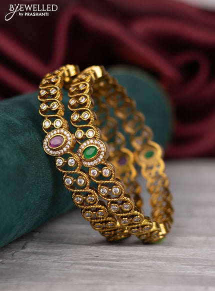 Antique bangle with red,white and green kemp stones