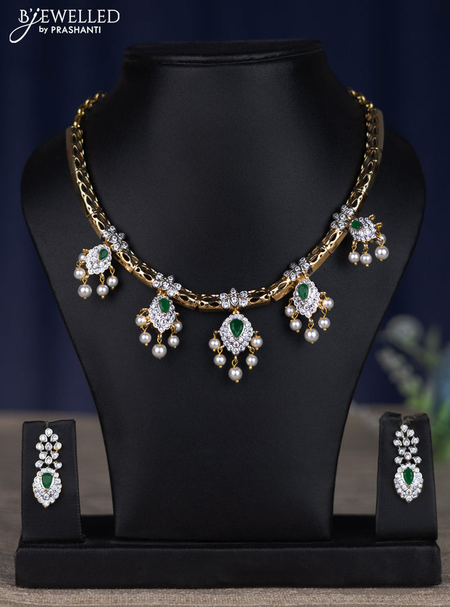 zircon necklace with emerald & cz stones and pearl hangings in gold finish