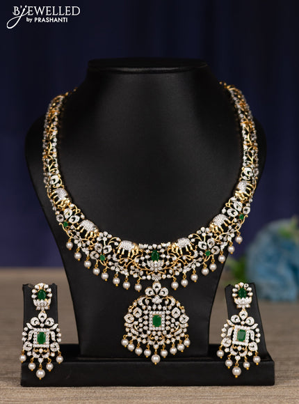 zircon necklace with emerald & cz stones and pearl hangings in gold finish