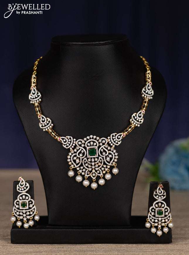 zircon necklace with emerald & cz stones and pearl hangings in gold finish