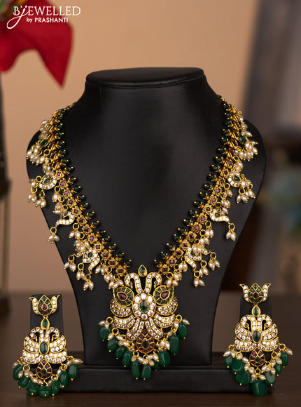 Antique necklace peacock & manga design with kemp & cz stones and pearl & green beads hanging