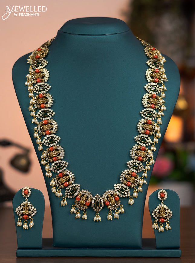 Antique haaram lakshmi design with pavalam green kemp & cz stones and pearl hangings