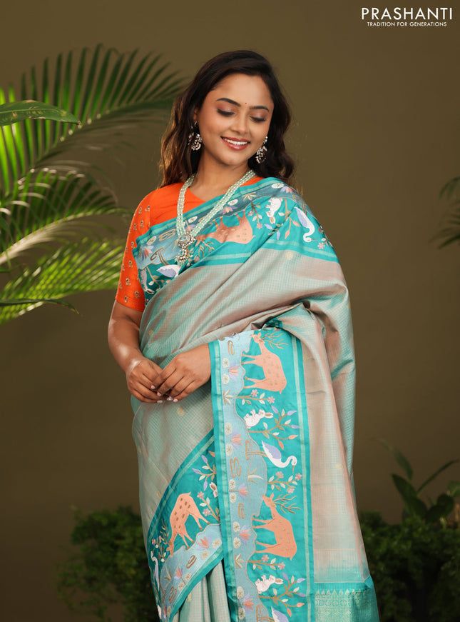 Dual shade of Teal Kanchipuram Silk saree with Border Embroidery