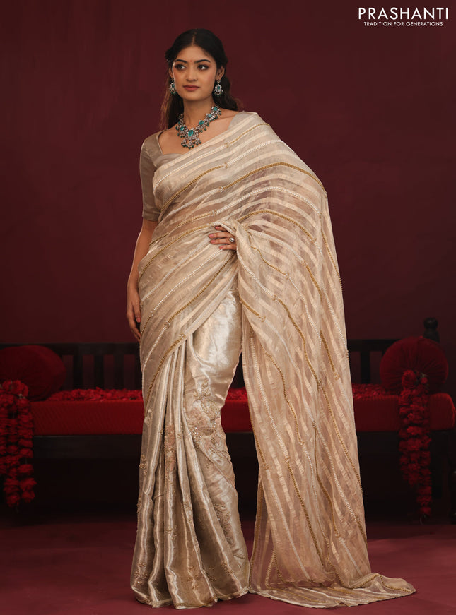 Tissue organza silk saree with allover stripes & embroidery