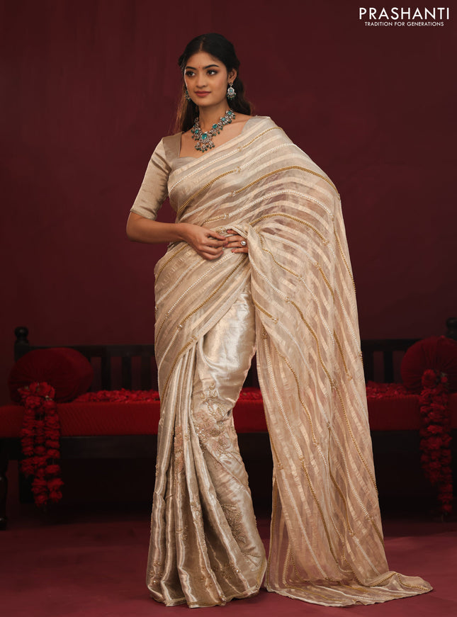 Tissue organza silk saree with allover stripes & embroidery