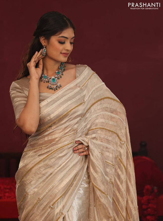 Tissue organza silk saree with allover stripes & embroidery